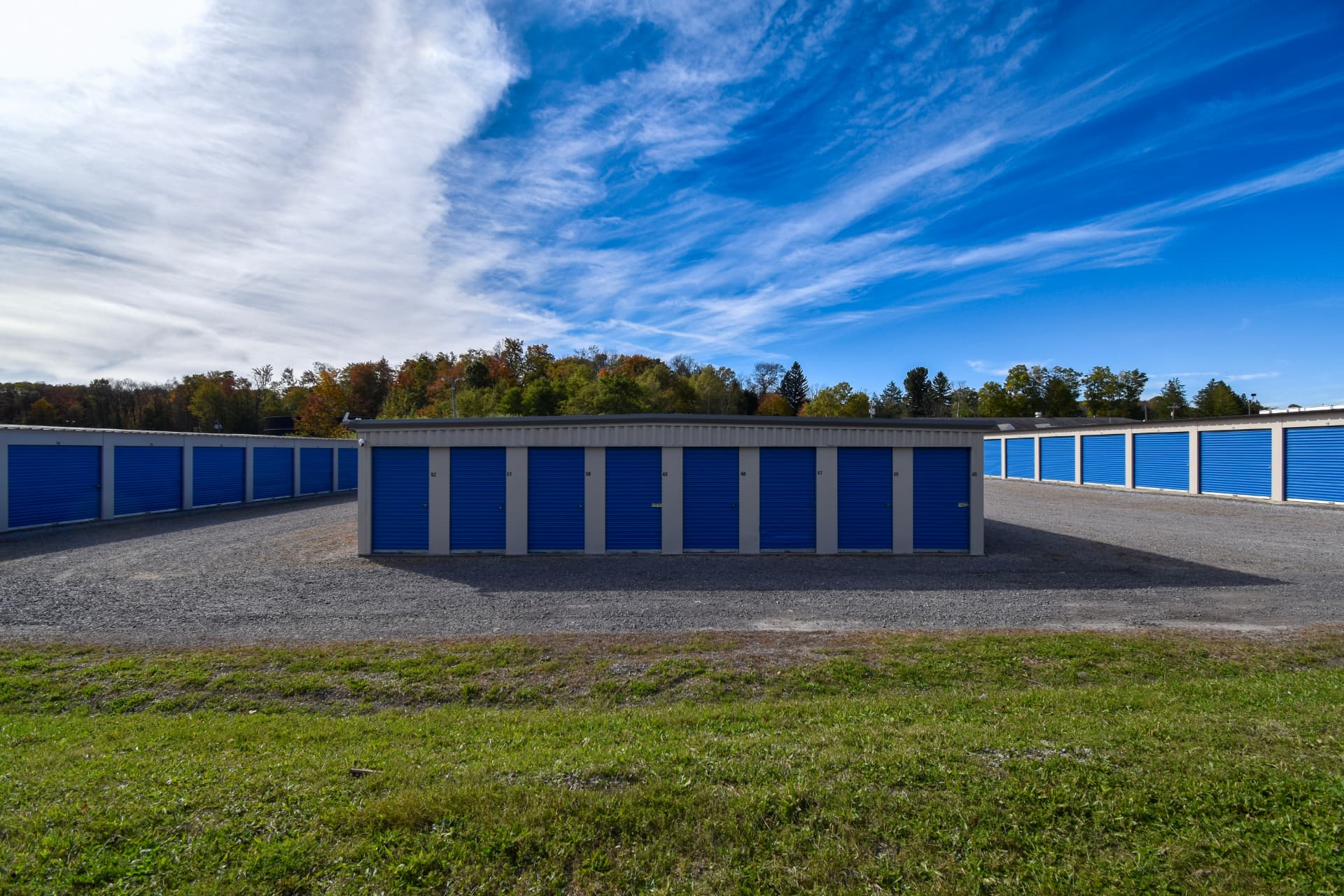 A wide original view of the storage buildings and gravel drives after the work.